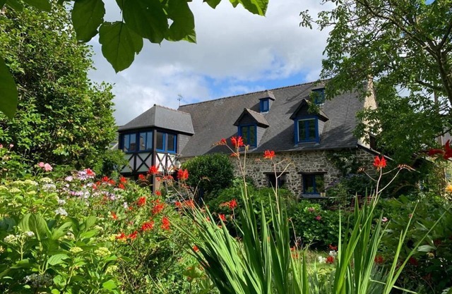 Large stone house in a green setting