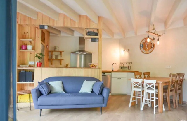 Le colibri, wooden house near river and forest