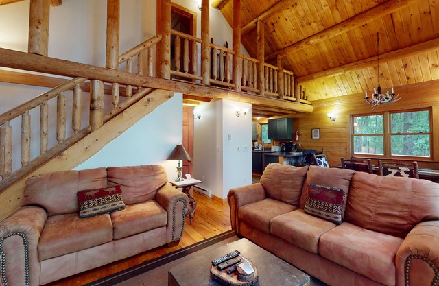 Log cabin in forested setting with private hot tub & amazing views, dog-friendly