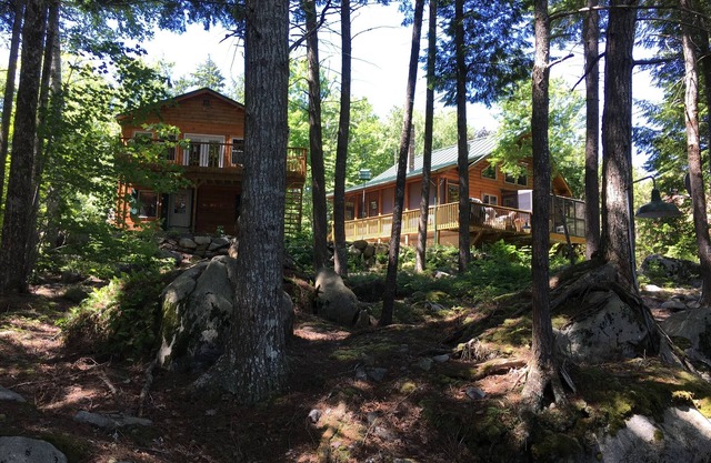 Log home on untouched cold stream lake