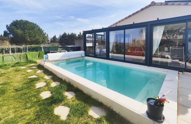 Look forward to this attractive vacation home with conservatory and pool.