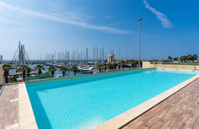 Lovely apartment for 4 guests with A/C, pool, WIFI, TV, terrace and parking