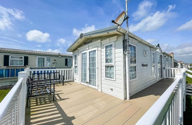Lovely caravan with large decking at Naze Marine Holiday Park ref 17306BR