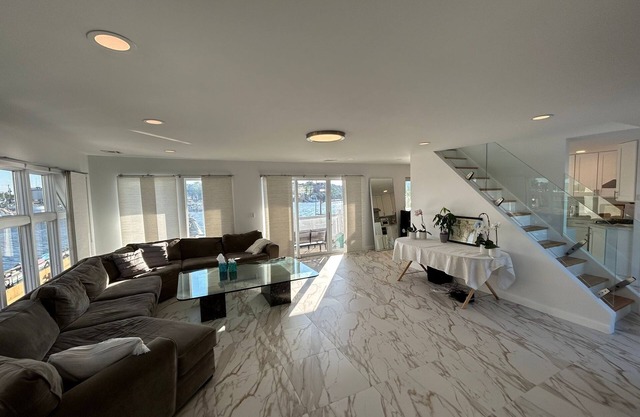 Luxurious Amenity Filled Water-Front Home in Family Friendly Neighborhood.