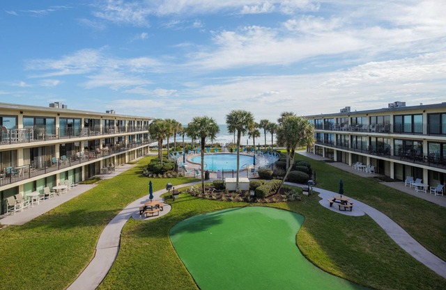 Luxury Condo with Balcony, Ocean View, Pool and Just Steps to the Beach