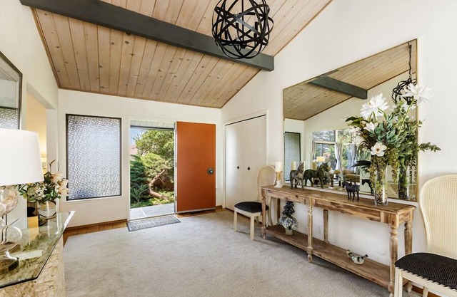 Mid-Century home with a beautiful view, deck, & rear fenced-in patio