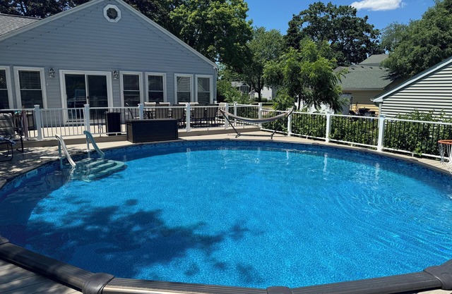 Modern 3 BR with a huge fenced yard and heated pool right by downtown