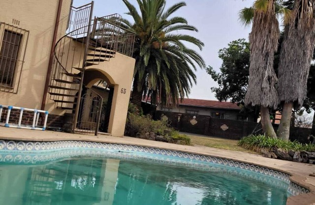 Modern guest house where guests can enjoy its outdoor pool, kids gym and garden.