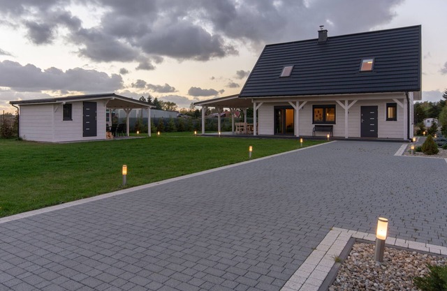Modern house CORNELLO with garden next to lagoon