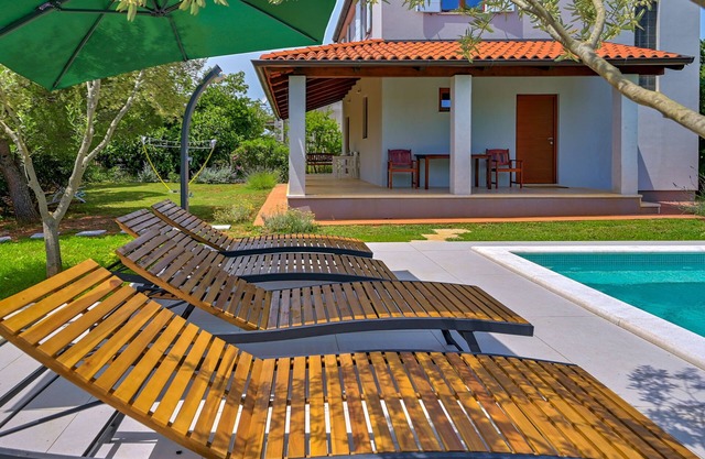 Modern house in a quiet location with a fenced garden, porch and private pool