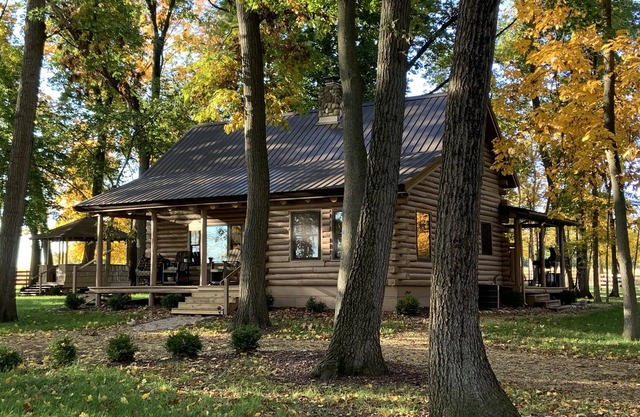 Modern Log Cabin in woods with two gas fireplaces; 20 acres; great location.