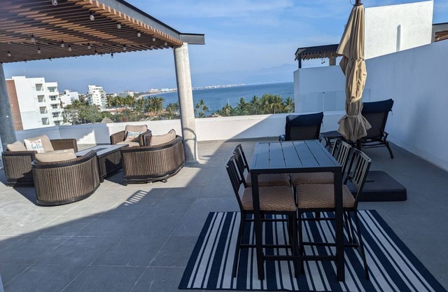Modern penthouse with private terrace -18 unit bldg- 1/2 block from the beach.