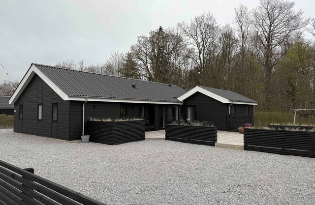 Modern summer house in Pøt with spa & sauna