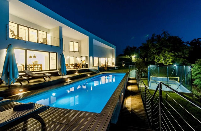 Modern villa with heated pool, whirlpool, volleyball court and mini football