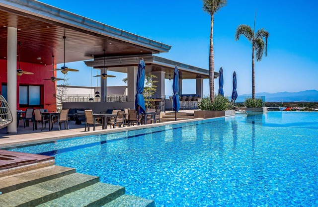 Mountain-view apartment near beach with balcony, rooftop pool, gym, & Ping-Pong