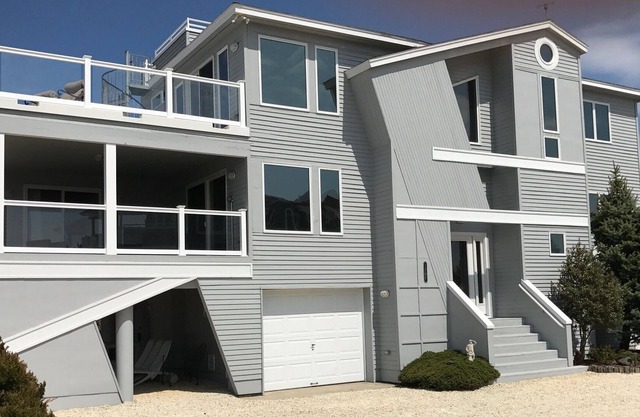 Newly Renovated Bay Front! Great views, beautiful heated pool. Private dock