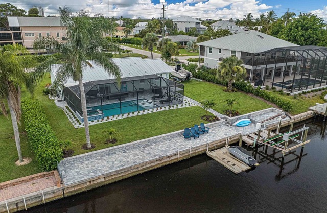 Newly Renovated house on the canal with pool and hot tub!