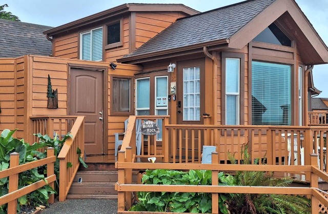 Ocean Cabin 23 is a cozy seaside bungalow with loft, limited ocean views, and private beach. Hot tub temporarily unavailable