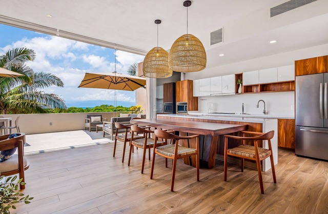 Ocean-view getaway with patio, grill, roof deck, & on-site pools