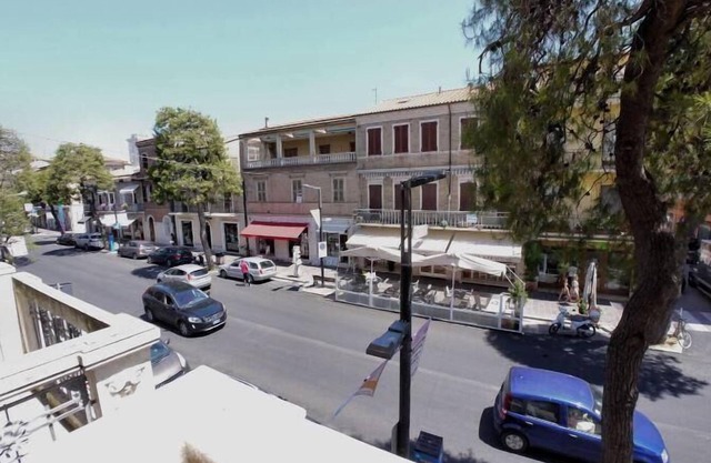 On the main street, just steps from the sea