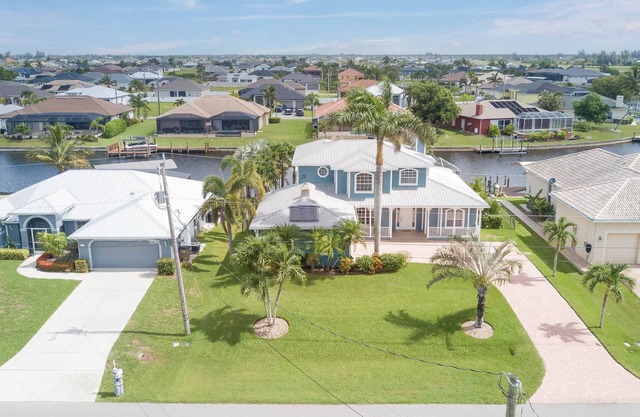 Paradise Palms NW Cape Coral Canal/Pool home with Tiki Hut and wide water views!