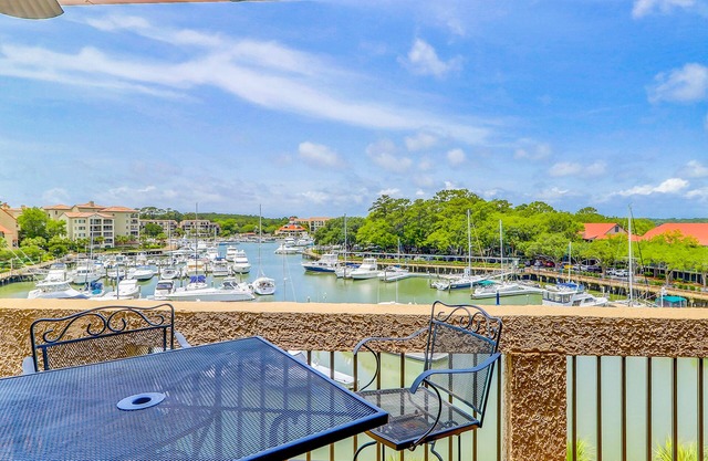 Penthouse living at Shelter Cove Marina with balcony, harbor view, pool & tennis