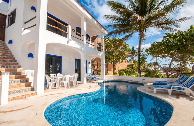 Perfect for a large group! Beachfront 7 bedroom villa with pool, AC and WiFi!