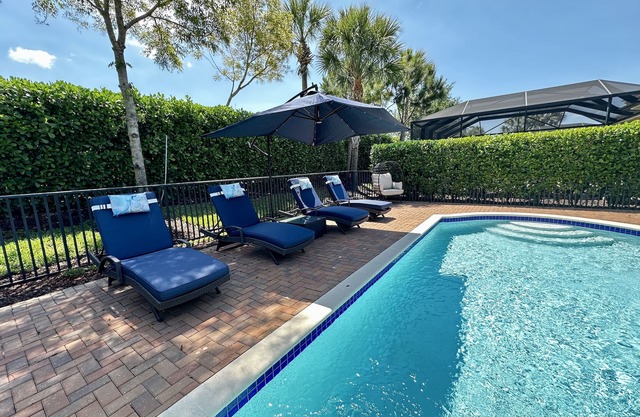 Pet friendly modern home with private heated pool in a gated community!