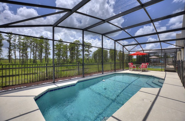 Pet friendly Pool Home with King suite 10 minutes to Disney World
