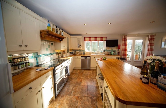 Polcarrek contemporary holiday home with parking and garden. Balcony with rural views