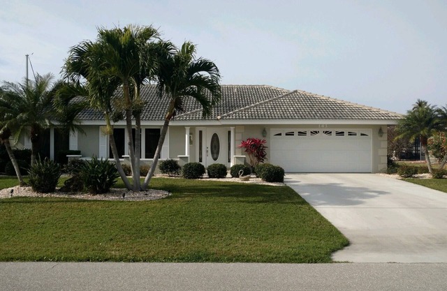 Pool house on a lagoon with sunset view