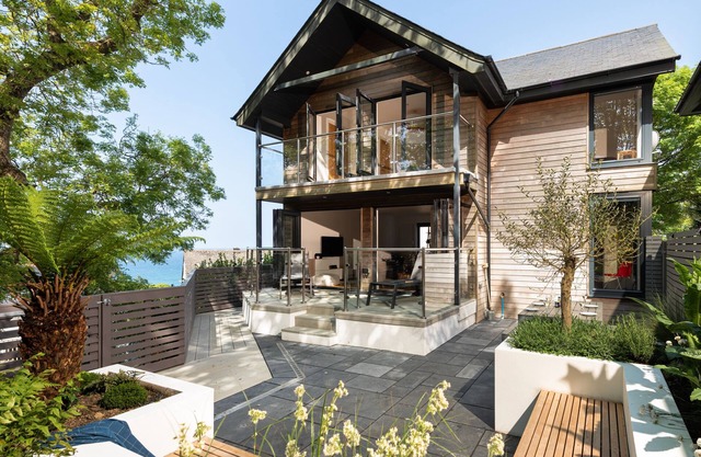 Porthia, stylish and spacious inside and out. Sunny terraces with sea views. Garage parking. Free WiFi.
