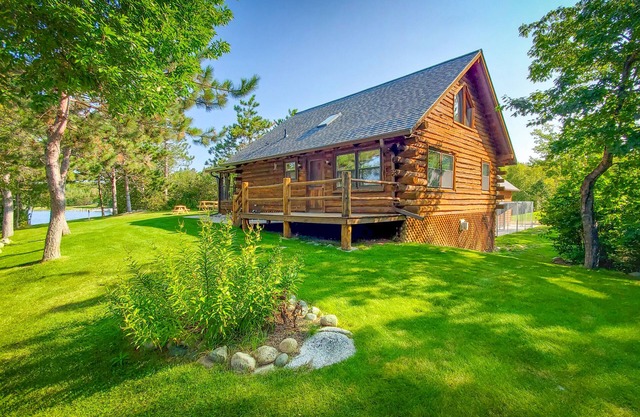 Pristine Log Cabin on 600' of Lake Shore.