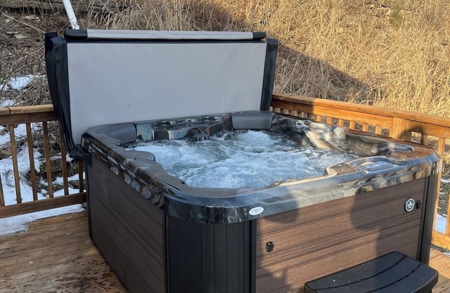 Private deck with hot tub and fire pit.