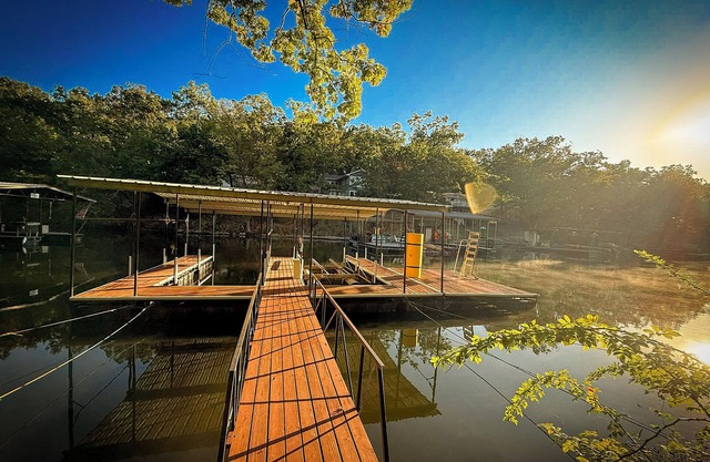 Private lakefront A-frame nestled in the forest on a quiet cove at Lake of the Ozarks. Sleeps 12 with 4 bedrooms, 2 baths, private dock, kayaks, coffee bar, and decks overlooking the water. Peaceful, scenic, and perfect for families or friends.