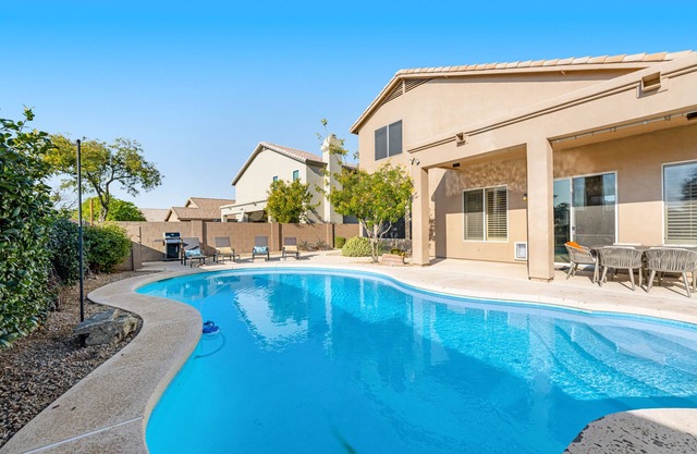 Private pool home with walled yard, firepit, grill & lanai - dog-friendly