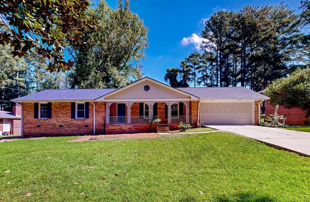 Quiet home in a convenient location with large yard, patio, & fireplace