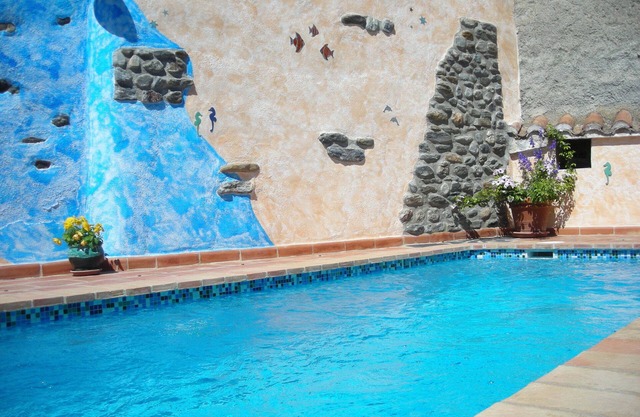 Quiet village house, central and comfortable with garden and heated pool, garage