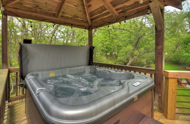 Relax in the hot tub with sounds from the nearby creek! - Bear Naked Hideaway