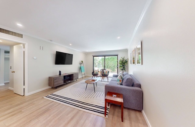 Remodeled ground-floor condo with pools, hot tub, tennis, & patio - dog-friendly