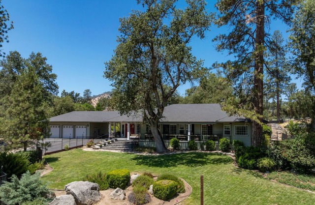 Riverbend Retreat 5-bedroom villa with spa, pond, gym, and private bar.