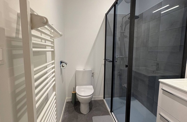 Room with bathroom and toilet in shared apartment, kitchen
