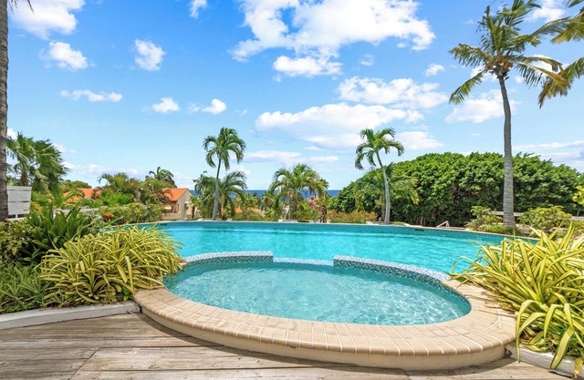 Royal Beach House with sea view and large community pool.
