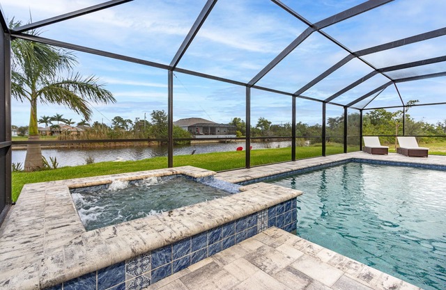 Salt water pool home with hot tub on fresh water canal and 40 foot pier 🌴
