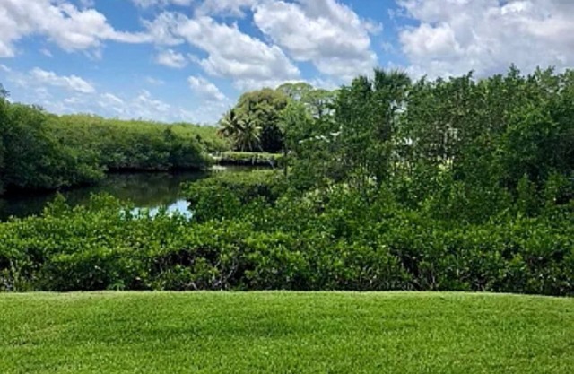 Secluded, cozy townhome on Manatee Creek, set in historic Port Salerno.