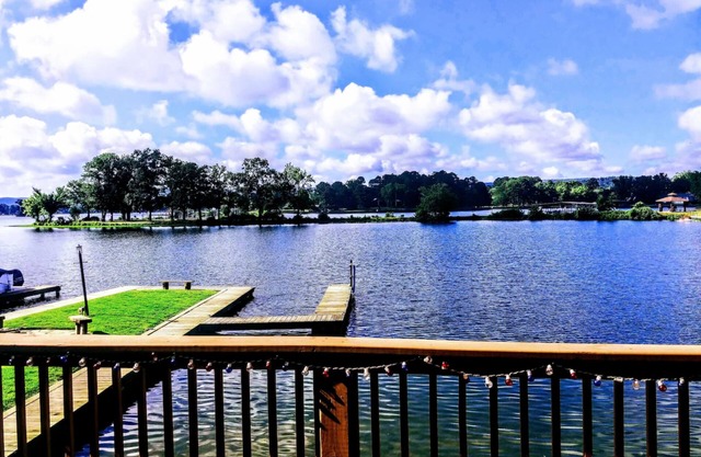 Serene lakefront condo with stunning views, private boat slip, and spacious deck