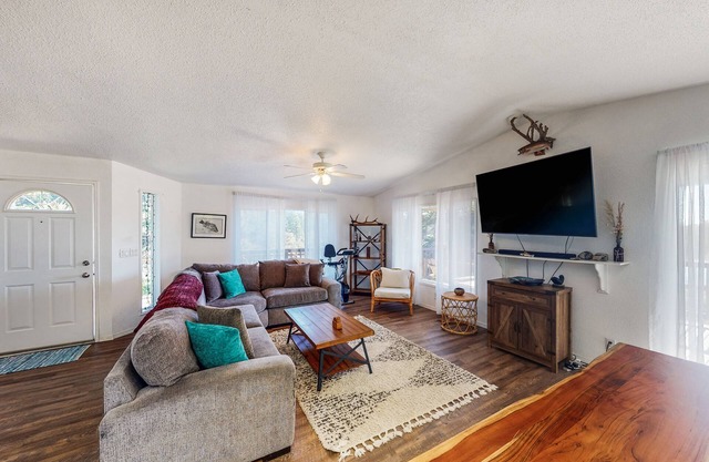 Serene waterfront haven with lake views, fenced yard & home office