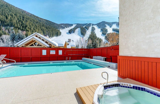 Ski-in/ski-out alpine condo with hot tub, sauna, seasonal pool & views