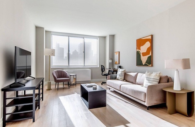 Sleek UES 1BR w/Elevator, Gym & Pool, nr Central Park, by Blueground