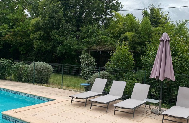 Small stone house with swimming pool and garden